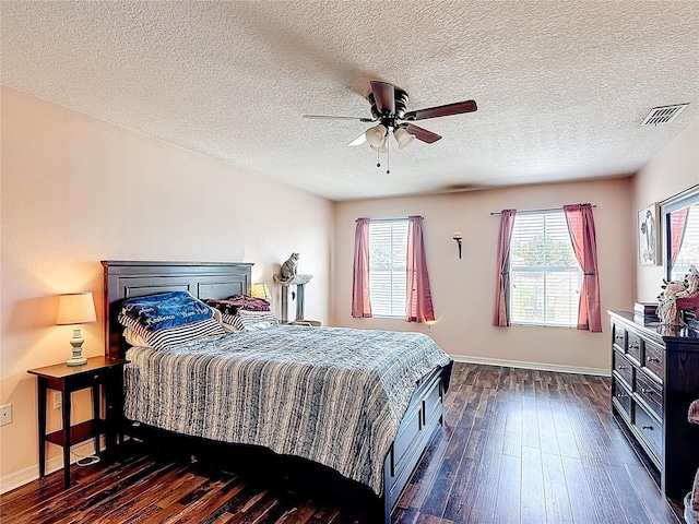 159 Lazy Willow Dr, Davenport, FL 33897 - bedroom featuring dark wood-style floors, baseboards, ceiling fan, and a textured ceiling
