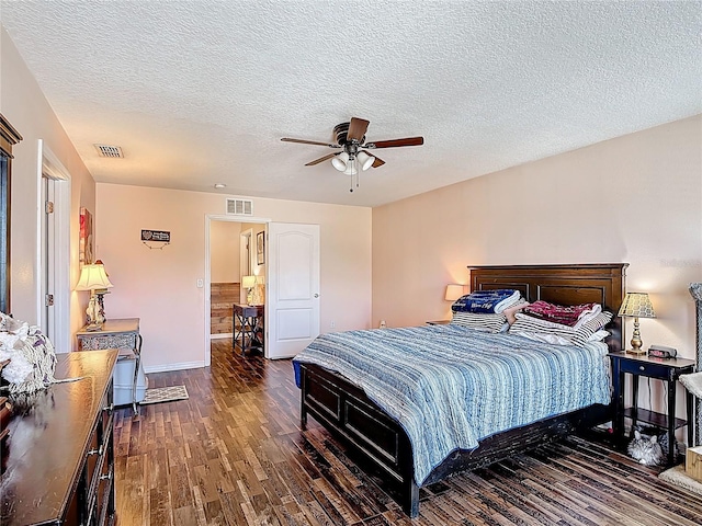 159 Lazy Willow Dr, Davenport, FL 33897 - bedroom with wood finished floors, baseboards, a textured ceiling, and ceiling fan