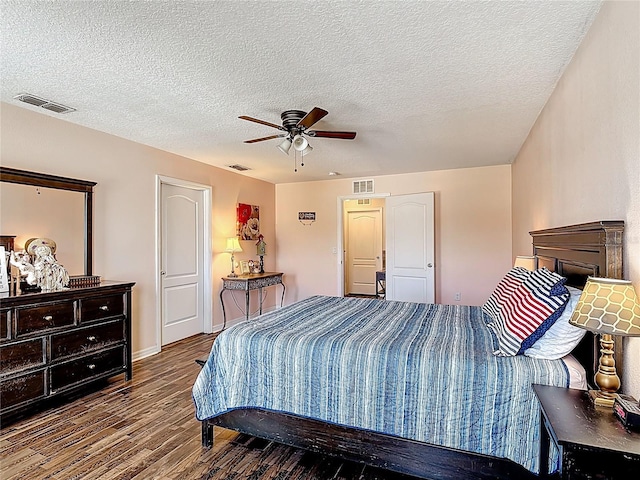 159 Lazy Willow Dr, Davenport, FL 33897 - bedroom with wood finished floors, a textured ceiling, baseboards, and ceiling fan