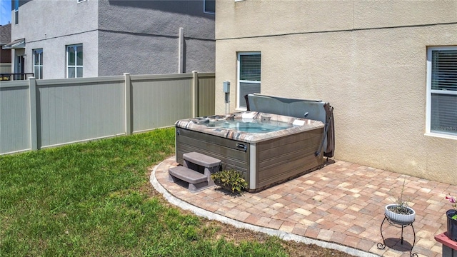 159 Lazy Willow Dr, Davenport, FL 33897 - exterior view of a hot tub and stucco siding