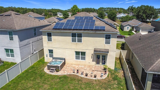 159 Lazy Willow Dr, Davenport, FL 33897 - back of property with french doors, stucco siding, a hot tub, and a patio