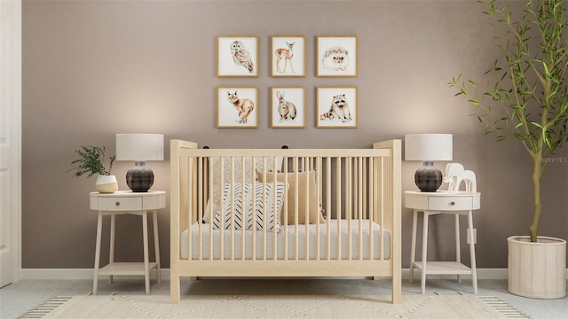 carpeted bedroom featuring baseboards
