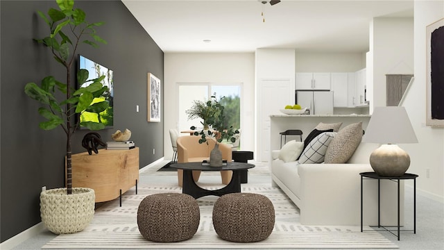living room featuring baseboards and light colored carpet