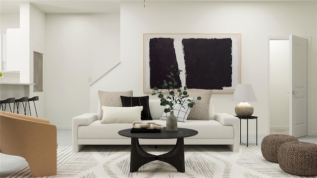 living area featuring baseboards