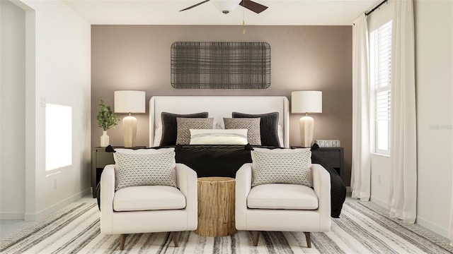 bedroom featuring baseboards and light colored carpet