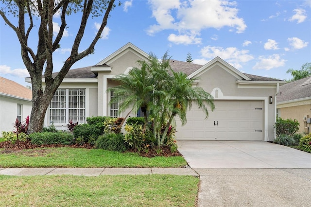 5628 Terrain De Golf Dr, Lutz, FL 33558 - ranch-style home featuring stucco siding, an attached garage, concrete driveway, and a shingled roof