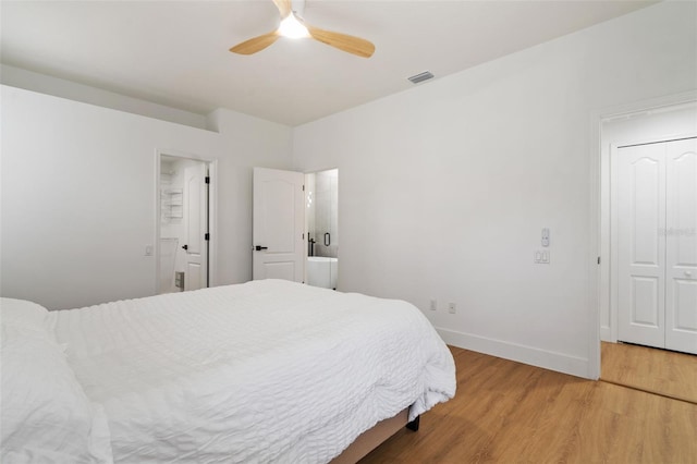 5628 Terrain De Golf Dr, Lutz, FL 33558 - bedroom with light wood-type flooring, baseboards, and ceiling fan