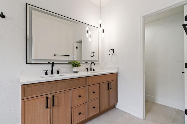 5628 Terrain De Golf Dr, Lutz, FL 33558 - bathroom featuring tile patterned flooring, double vanity, and baseboards