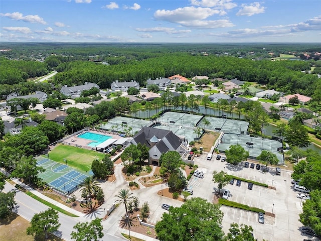 5628 Terrain De Golf Dr, Lutz, FL 33558 - aerial perspective of suburban area featuring a pool and a heavily wooded area