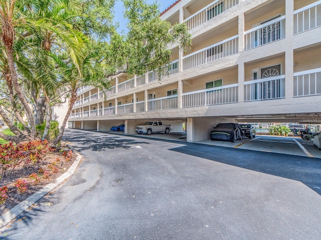 640 Bayway Blvd Unit 302, Clearwater Beach, FL 33767 - view of apartment building / complex featuring covered parking