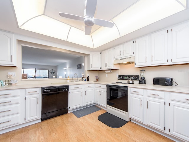 640 Bayway Blvd Unit 302, Clearwater Beach, FL 33767 - kitchen with black dishwasher, range with electric cooktop, under cabinet range hood, light wood-style flooring, and white cabinetry