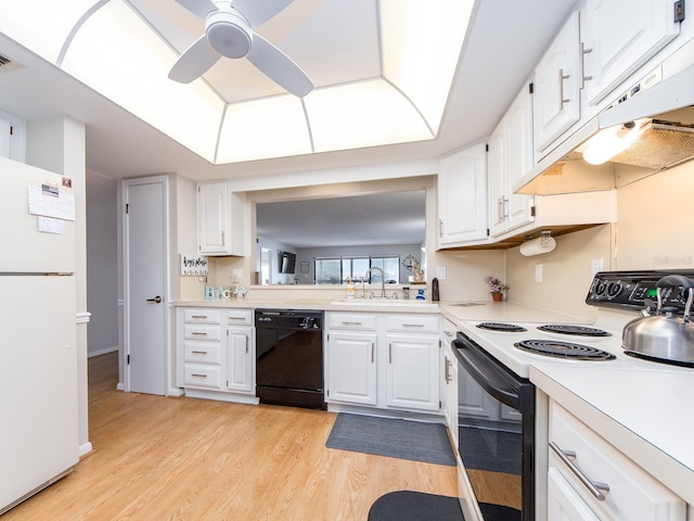 640 Bayway Blvd Unit 302, Clearwater Beach, FL 33767 - kitchen with range with electric cooktop, freestanding refrigerator, dishwasher, under cabinet range hood, and a sink