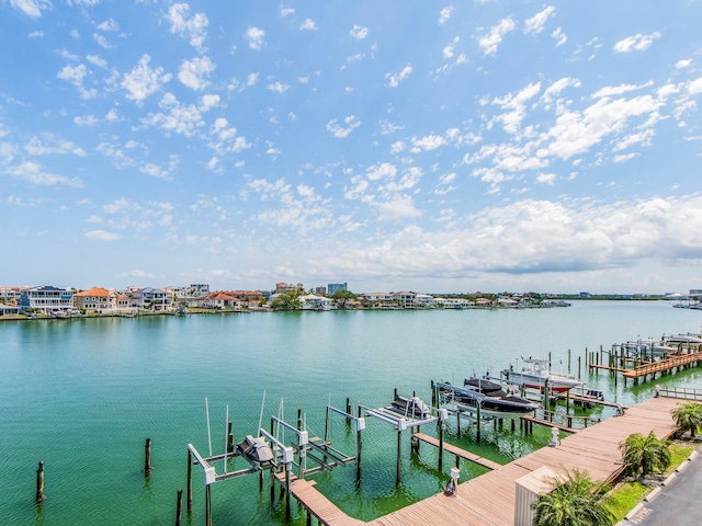 640 Bayway Blvd Unit 302, Clearwater Beach, FL 33767 - dock featuring boat lift and a water view