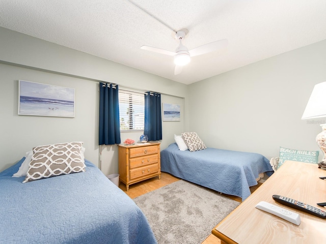 640 Bayway Blvd Unit 302, Clearwater Beach, FL 33767 - bedroom featuring light wood finished floors and ceiling fan