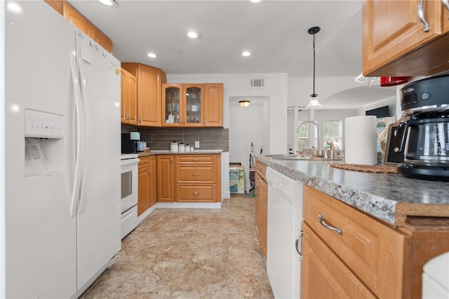 kitchen featuring white appliances, a sink, glass insert cabinets, recessed lighting, and backsplash