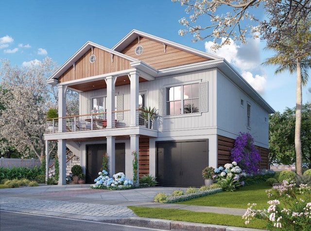 600 Banana St, Tarpon Springs, FL 34689 - view of front of home with a balcony, asphalt driveway, an attached garage, and fence