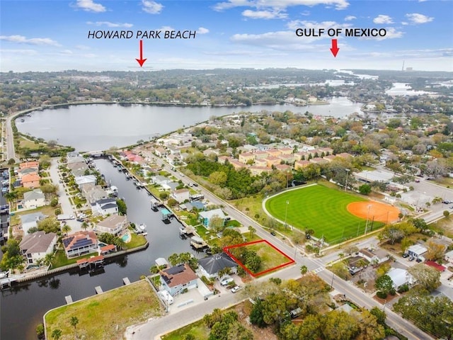 600 Banana St, Tarpon Springs, FL 34689 - aerial perspective of suburban area featuring property parcel outlined and a nearby body of water