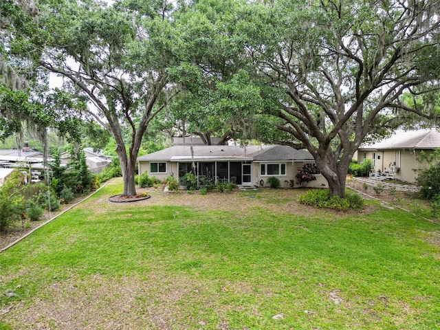 7216 N Mobley Rd, Odessa, FL 33556 - view of green lawn featuring a sunroom