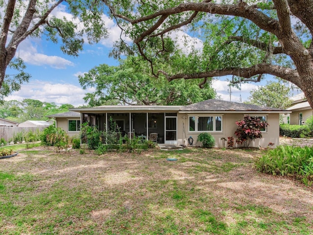 7216 N Mobley Rd, Odessa, FL 33556 - back of property with a sunroom and stucco siding