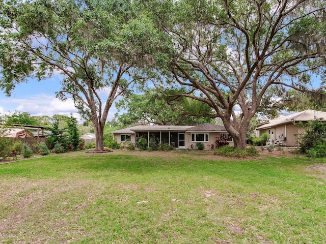 7216 N Mobley Rd, Odessa, FL 33556 - view of yard featuring a sunroom