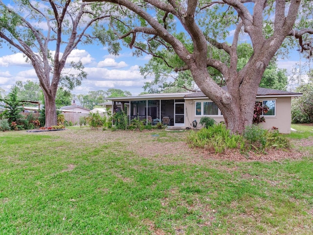 7216 N Mobley Rd, Odessa, FL 33556 - rear view of property featuring a sunroom