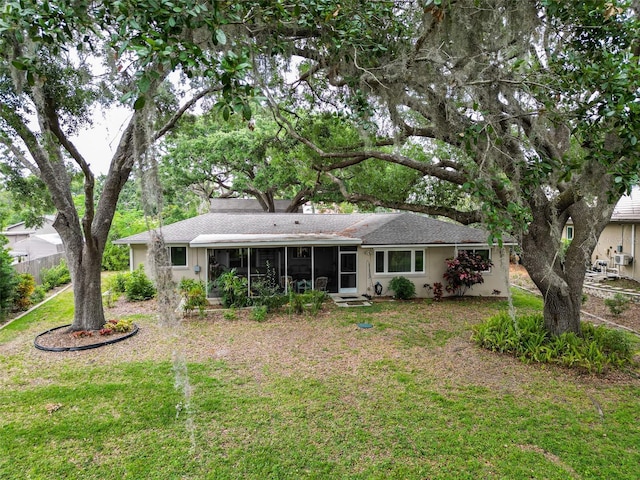 7216 N Mobley Rd, Odessa, FL 33556 - back of property with a sunroom and a shingled roof