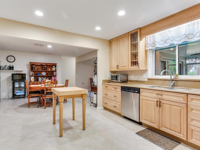 7216 N Mobley Rd, Odessa, FL 33556 - kitchen with stainless steel dishwasher, a sink, light brown cabinetry, light countertops, and recessed lighting