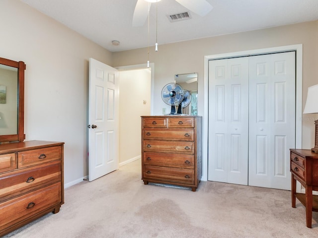 7216 N Mobley Rd, Odessa, FL 33556 - bedroom with light carpet, a closet, and ceiling fan