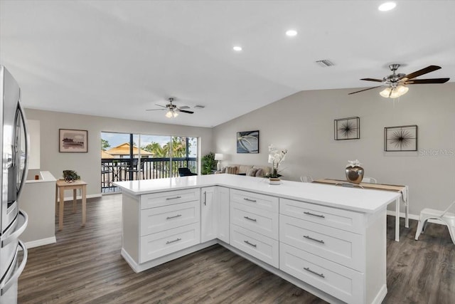 kitchen with a ceiling fan, stainless steel fridge with ice dispenser, lofted ceiling, dark wood-style flooring, and recessed lighting