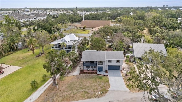 aerial view of residential area with a tree filled landscape