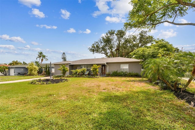 5245 18th St N, Saint Petersburg, FL 33714 - ranch-style home featuring a front yard and stucco siding