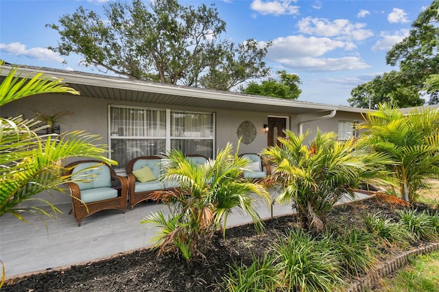 5245 18th St N, Saint Petersburg, FL 33714 - view of front of property featuring stucco siding and a patio area