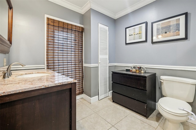 5245 18th St N, Saint Petersburg, FL 33714 - bathroom with toilet, crown molding, vanity, and tile patterned flooring