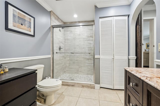 5245 18th St N, Saint Petersburg, FL 33714 - full bath with a shower stall, a closet, tile patterned flooring, crown molding, and vanity