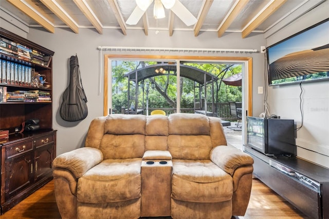 5245 18th St N, Saint Petersburg, FL 33714 - sitting room with wood finished floors, a ceiling fan, beam ceiling, and plenty of natural light