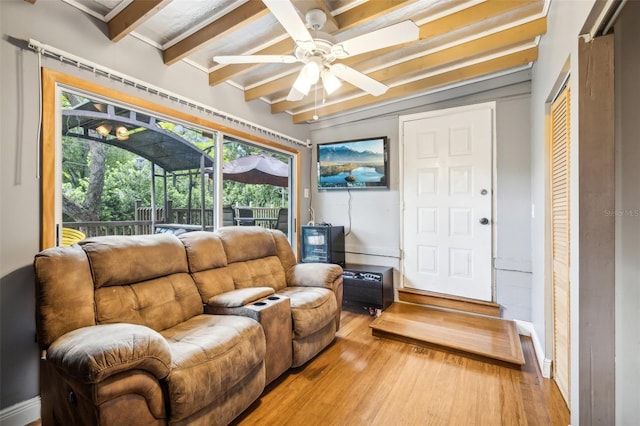5245 18th St N, Saint Petersburg, FL 33714 - living room with ceiling fan, light wood-style floors, beamed ceiling, and baseboards