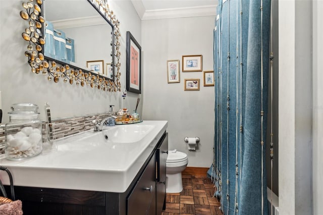 5245 18th St N, Saint Petersburg, FL 33714 - bathroom with toilet, vanity, crown molding, and backsplash