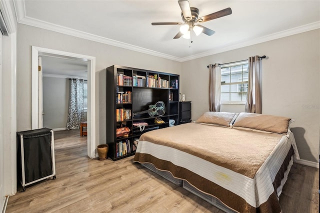 5245 18th St N, Saint Petersburg, FL 33714 - bedroom with crown molding, light wood-type flooring, baseboards, and ceiling fan