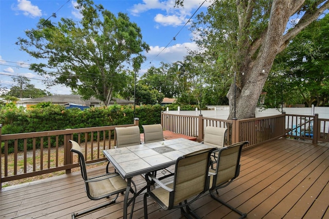 5245 18th St N, Saint Petersburg, FL 33714 - wooden terrace with outdoor dining area