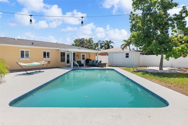 4027 25th Ave N, Saint Petersburg, FL 33713 - view of pool with outdoor lounge area, a fenced backyard, a patio area, an outdoor structure, and a storage unit