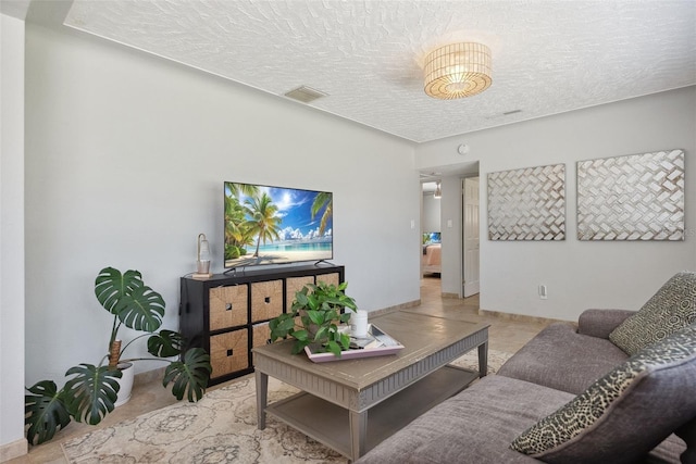 4027 25th Ave N, Saint Petersburg, FL 33713 - living room with a textured ceiling and baseboards