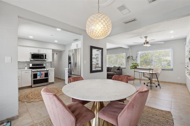 4027 25th Ave N, Saint Petersburg, FL 33713 - dining area with light tile patterned floors, a ceiling fan, baseboards, and recessed lighting