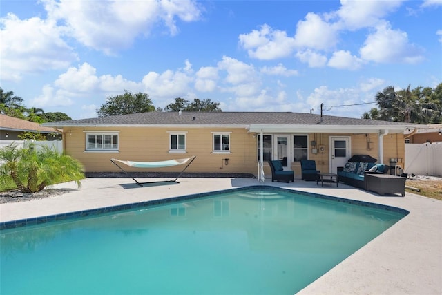 4027 25th Ave N, Saint Petersburg, FL 33713 - back of house with an outdoor living space, a patio, and fence