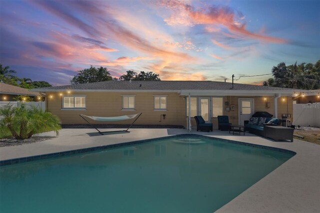 4027 25th Ave N, Saint Petersburg, FL 33713 - back of property with an outdoor living space, a patio, and fence