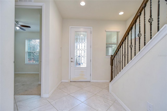 foyer with baseboards, stairway, light tile patterned floors, recessed lighting, and ceiling fan