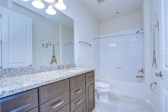 bathroom with toilet, vanity, tile patterned floors, and tub / shower combination