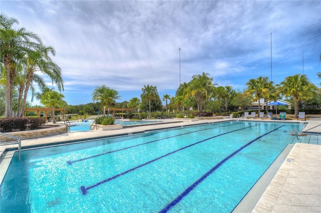 community pool featuring a patio area