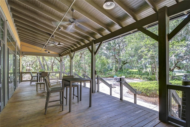 deck featuring a ceiling fan and outdoor dining area