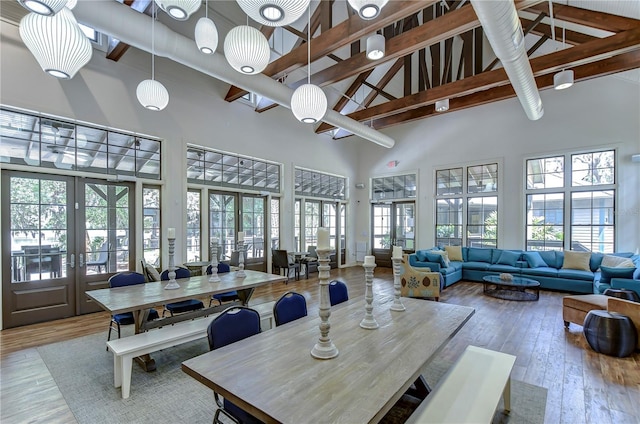 common area featuring high vaulted ceiling and beamed ceiling
