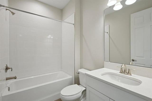 bathroom featuring toilet, shower / bath combination, and vanity
